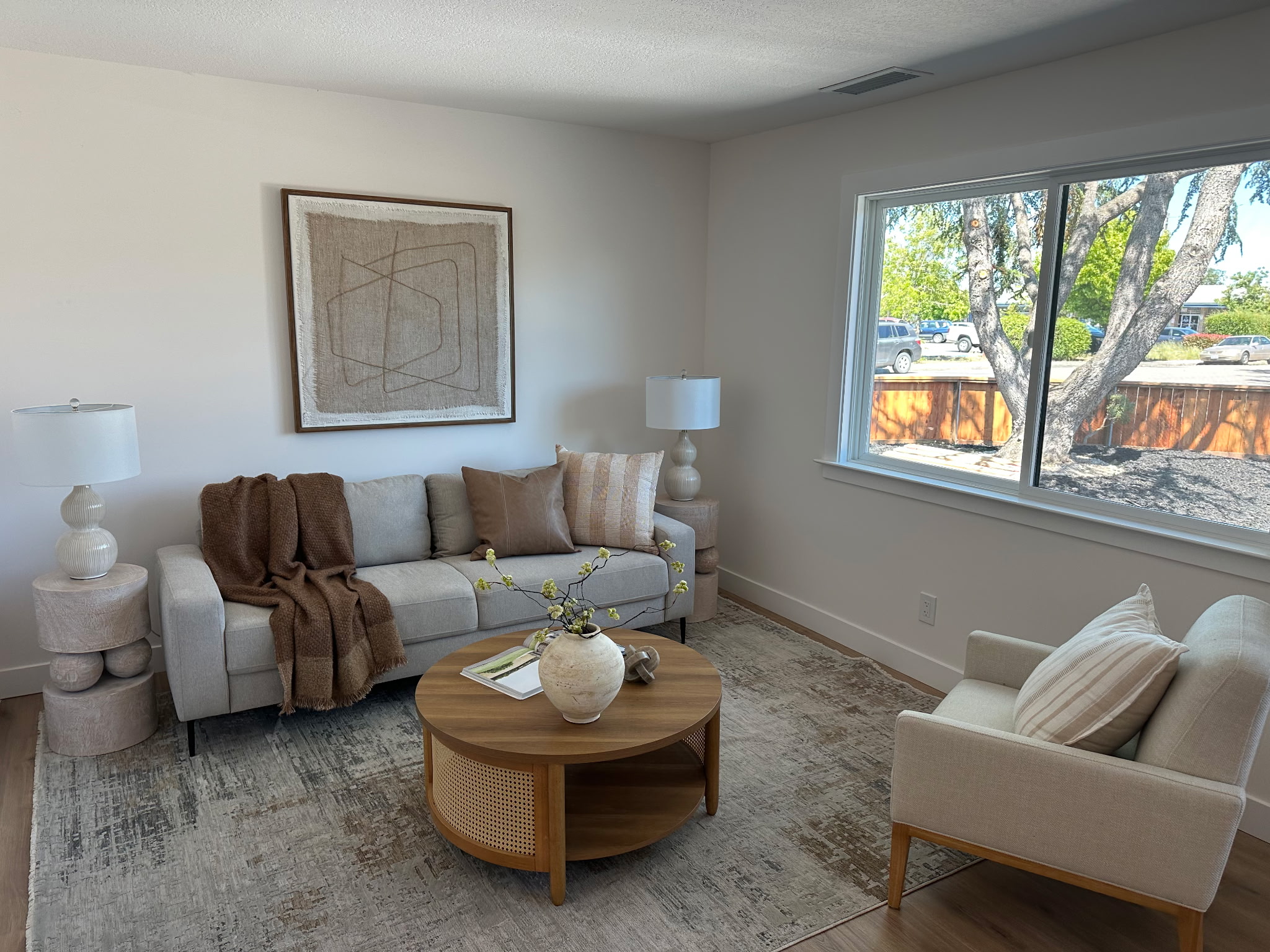 Natural living room staged with woven textures and warm wood