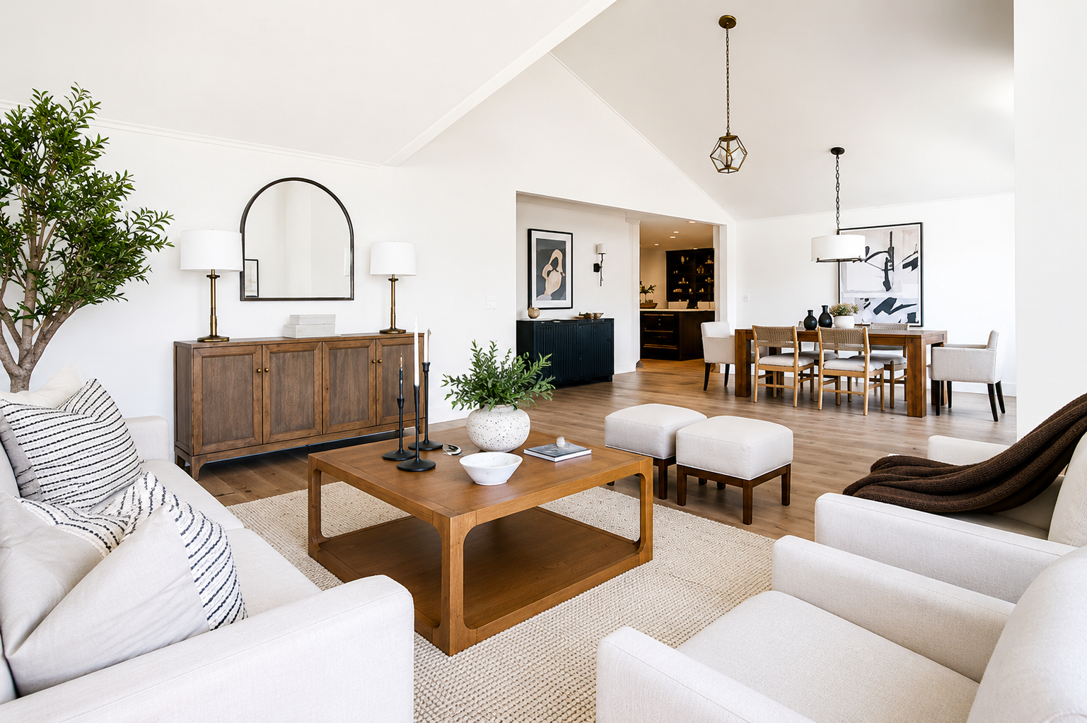 Bright open living and dining room staged by Black Horse Staging